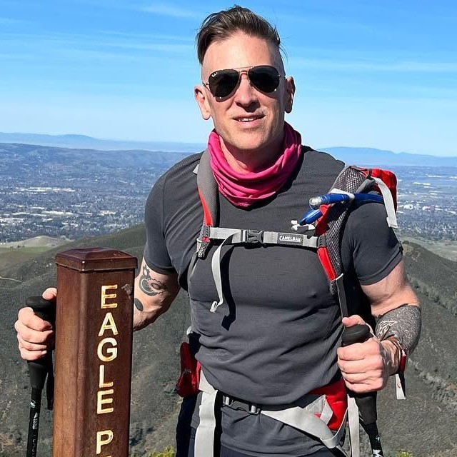 Andy at the Eagle Peak summit on a hike